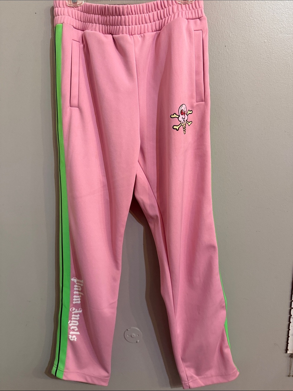 Palm Angels Pink Track Pants with Neon Green Side Stripe and Skull Patch